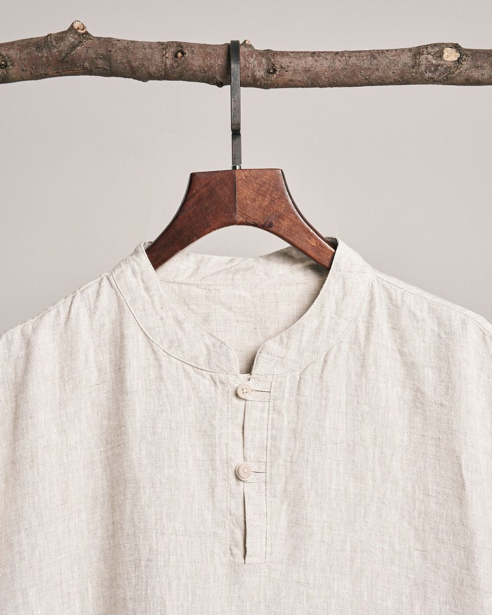 A close view of a linen-cotton placket with corozo buttons